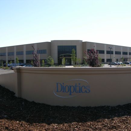 A large building featuring a prominent sign displayed on its exterior.