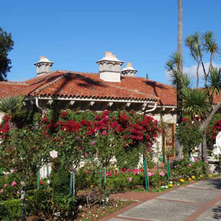 A red brick building with a classic design, showcasing its sturdy and timeless architectural features.